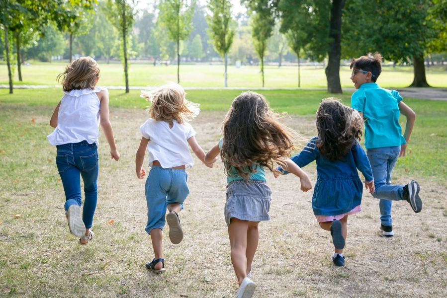 group-kids-running-grass-together-having-race-park-back-view-full-length-children-outdoor-activity-concept-2048x1366